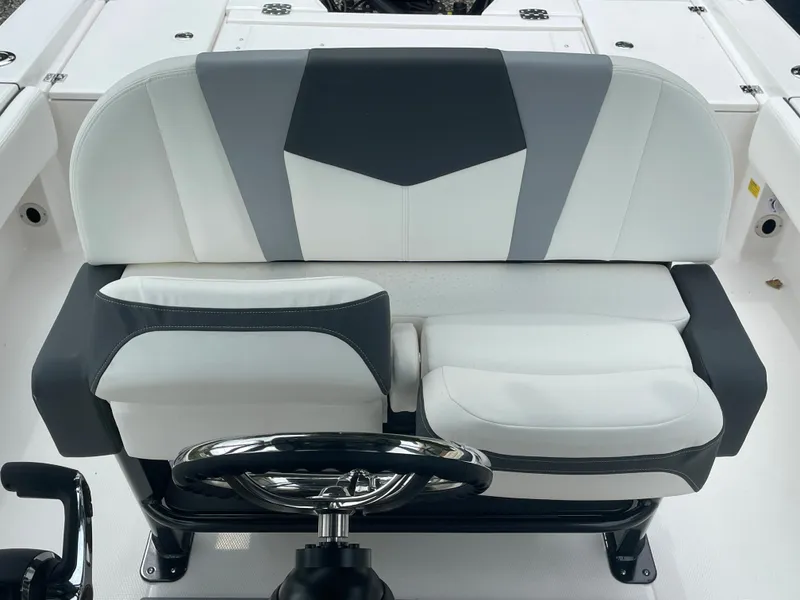 Slide: The Image of 2023 Robalo 266 Cayman boat helm seat with modern design and comfortable cushioning. - 21