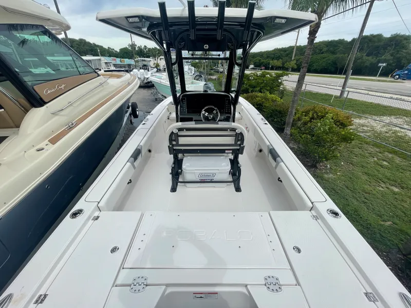 Slide: The Image of 2023 Robalo 266 Cayman boat interior with center console and seating. - 3