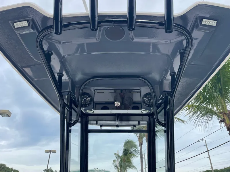 Slide: The Image of 2023 Robalo 266 Cayman T-top with integrated lighting and speakers. - 6