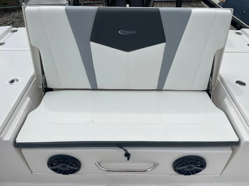 Slide: The Image of 2023 Robalo 266 Cayman boat seat with integrated speakers and storage handle. - 8