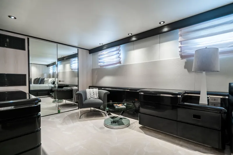 Slide: The Image of Luxurious interior of a 1989 Broward Tri-Deck yacht with modern furnishings. - 19