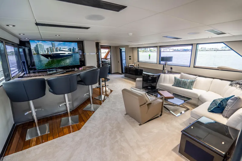 Slide: The Image of Luxurious interior of 1989 Broward Tri-Deck yacht with modern furnishings and panoramic windows. - 25