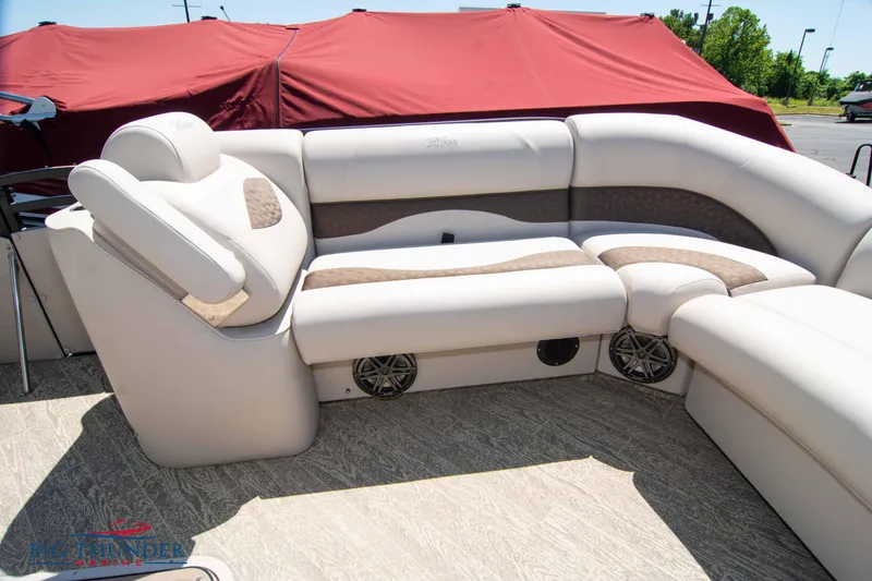 Slide: The Image of 2022 JC SunLounger 25 TT Sport boat interior with beige and brown seating. - 11