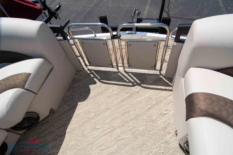 Slide: The Image of 2022 JC SunLounger 25 TT Sport boat interior with plush seating and safety gate. - 15