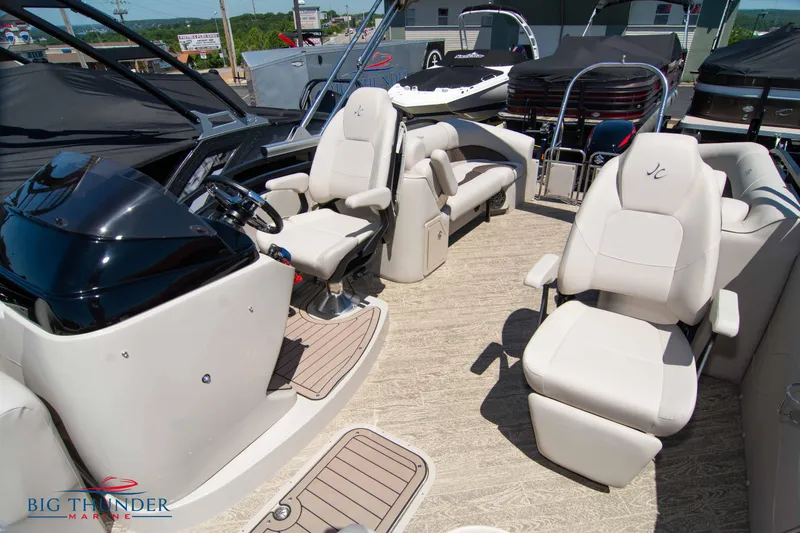 Slide: The Image of 2022 JC SunLounger 25 TT Sport interior with plush seating and modern helm. - 17