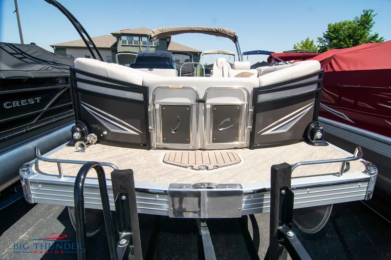 Slide: The Image of 2022 JC SunLounger 25 TT Sport pontoon boat rear view at marina. - 2