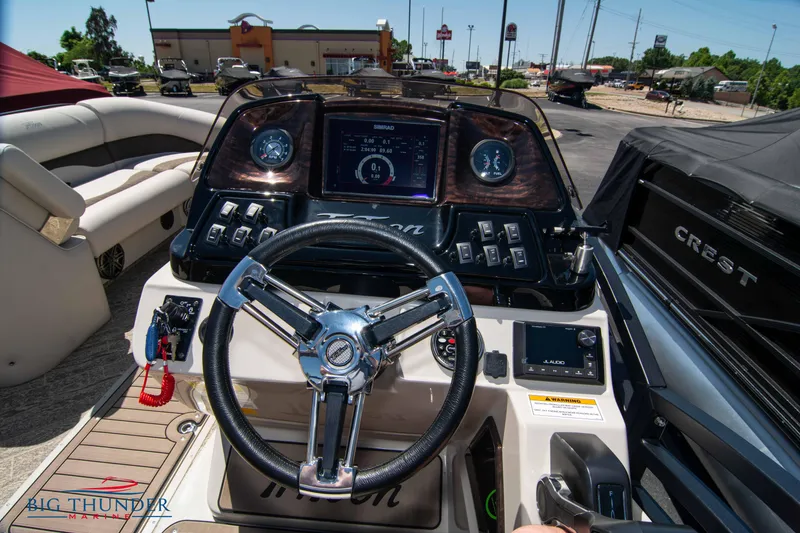Slide: The Image of Cockpit view of 2022 JC SunLounger 25 TT Sport boat with steering wheel and dashboard. - 20