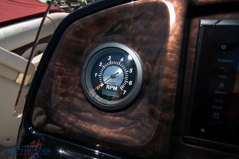 Slide: The Image of Close-up of RPM gauge on 2022 JC SunLounger 25 TT Sport boat dashboard. - 22