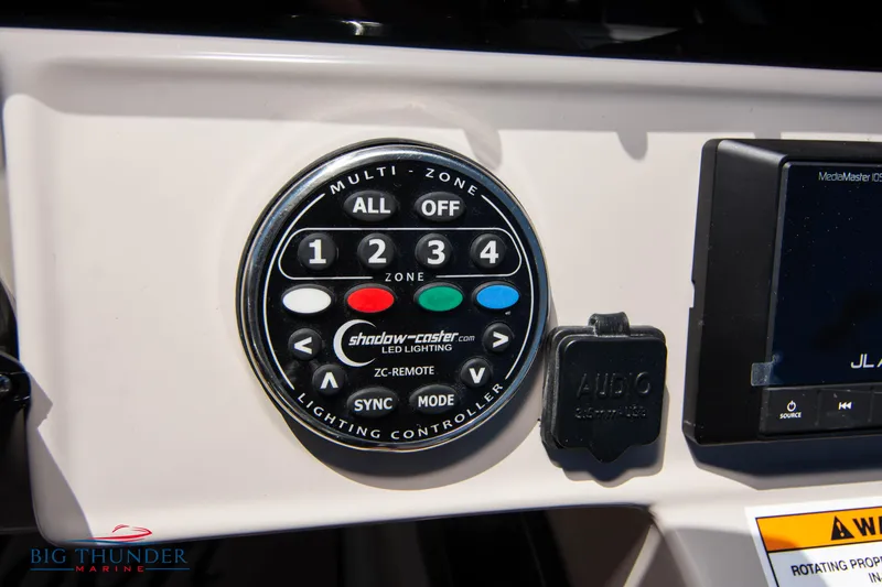 Slide: The Image of Control panel of a 2022 JC SunLounger 25 TT Sport boat with multi-zone lighting controller. - 28