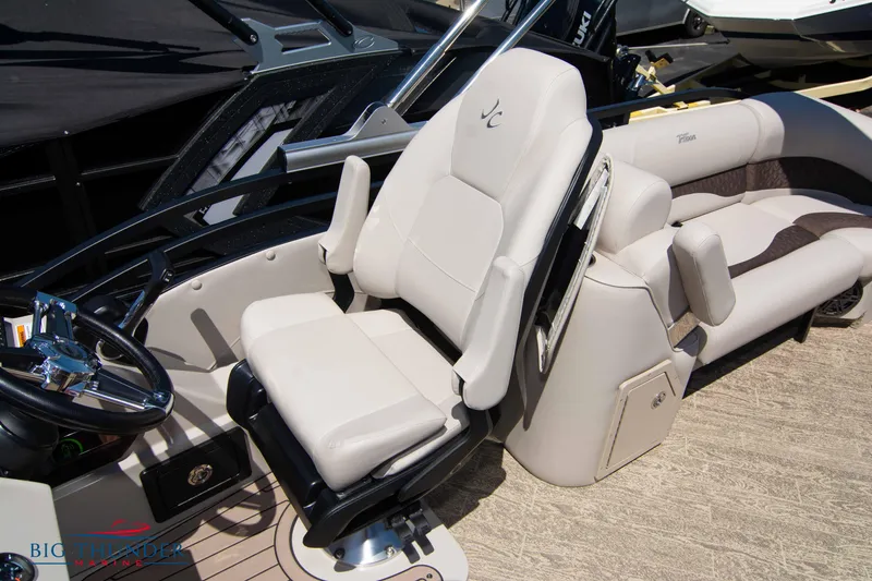 Slide: The Image of 2022 JC SunLounger 25 TT Sport boat interior with captain's chair and passenger seating. - 33