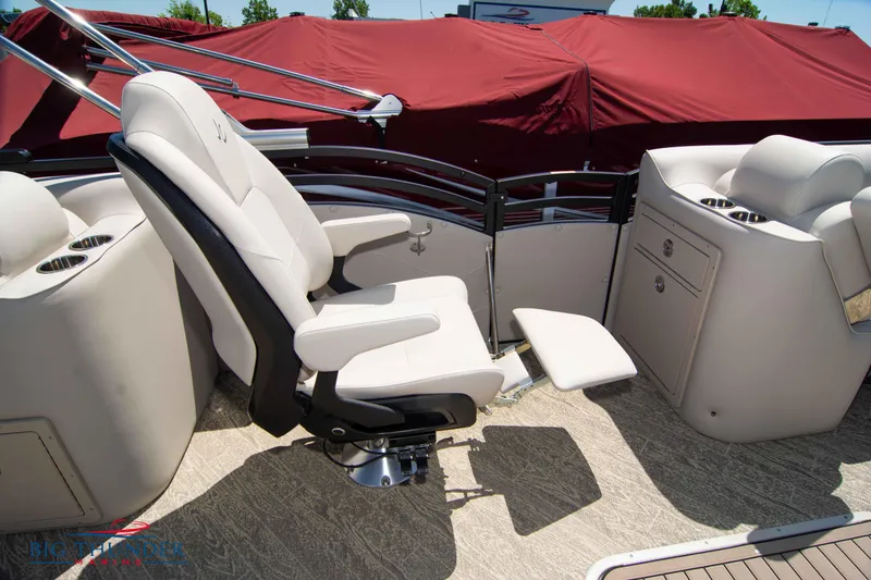 Slide: The Image of Luxury seating on 2022 JC SunLounger 25 TT Sport boat with red cover in background. - 35