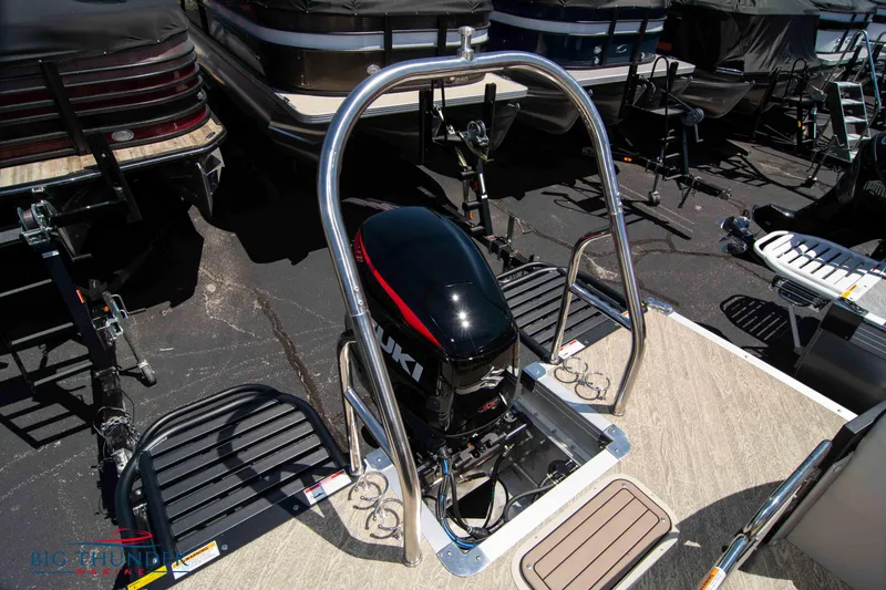 Slide: The Image of 2022 JC SunLounger 25 TT Sport boat with Suzuki outboard motor in a marina. - 45