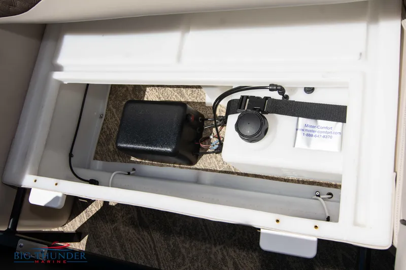 Slide: The Image of 2022 JC SunLounger 25 TT Sport storage compartment with electrical components. - 48