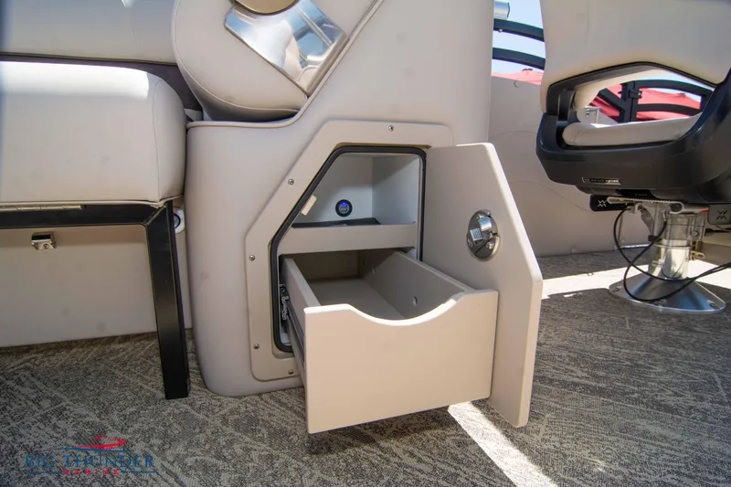 Slide: The Image of Open storage compartment in 2022 JC SunLounger 25 TT Sport boat interior. - 49