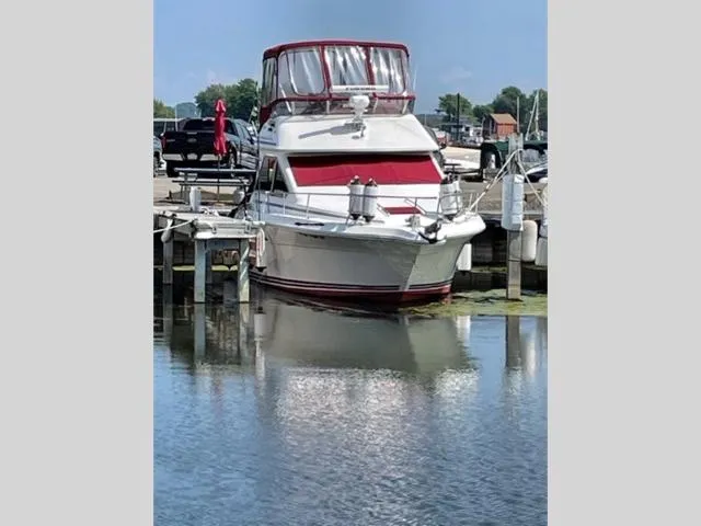 The Image of 1989 Sea Ray 300 Sedan Bridge docked at a marina. - 1