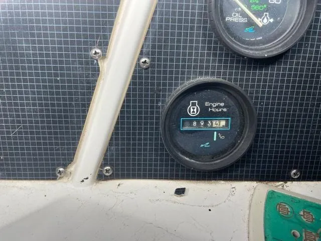 Slide: The Image of Close-up of 1989 Sea Ray 300 Sedan Bridge engine hours gauge. - 14