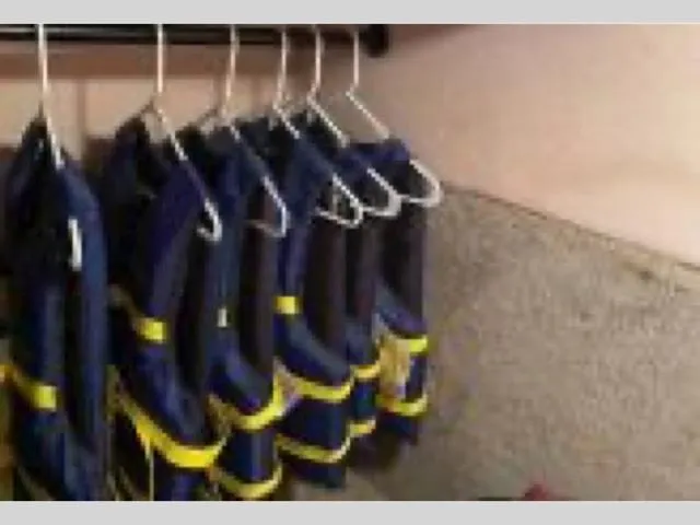 Slide: The Image of Life jackets hanging inside a 1989 Sea Ray 300 Sedan Bridge boat. - 28