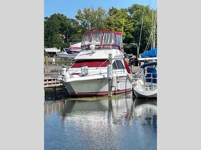 Slide: The Image of 1989 Sea Ray 300 Sedan Bridge docked at a marina. - 5
