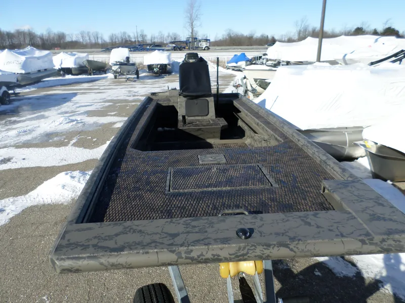 Slide: The Image of 2023 GATOR-TAIL GB 1852 Predss boat in a snowy outdoor storage area. - 3