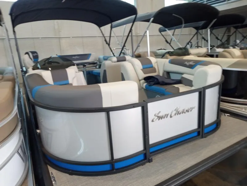 The Image of 2023 SunChaser Geneva Sport 23 SB pontoon boat with blue and white seating. - 0
