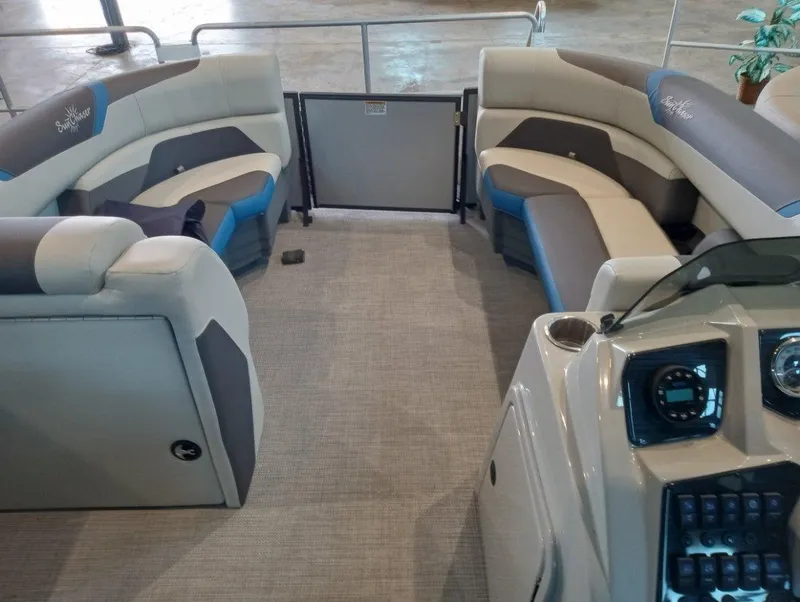 Slide: The Image of 2023 SunChaser Geneva Sport 23 SB pontoon boat interior with plush seating and modern dashboard. - 4