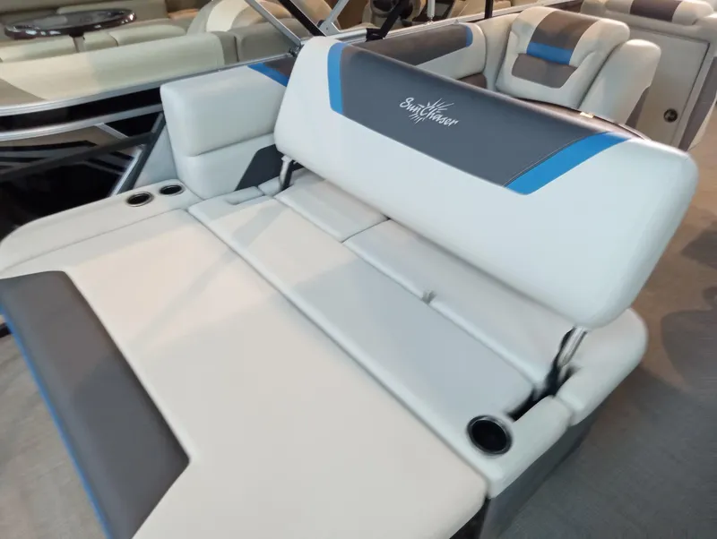 Slide: The Image of 2023 SunChaser Geneva Sport 23 SB boat interior with white and blue seating. - 7