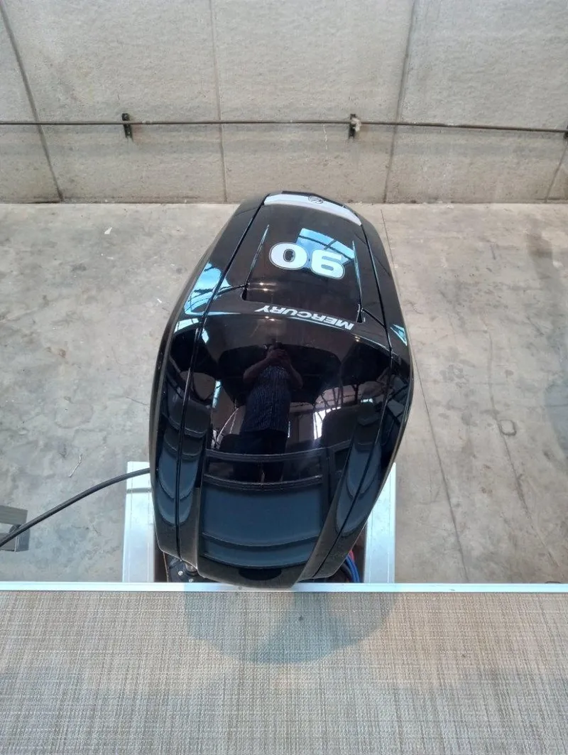 Slide: The Image of 2023 SunChaser Vista 20 LR with a 90 HP Mercury outboard motor. - 6