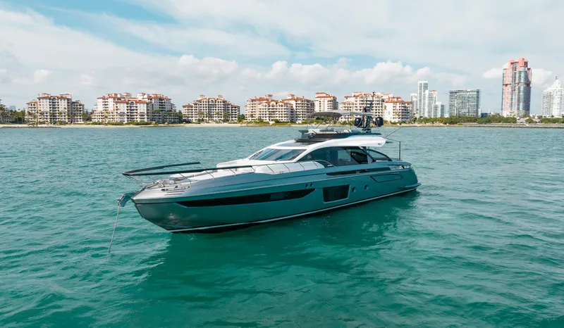The Image of 2022 Azimut S8 yacht cruising near coastal city skyline. - 0