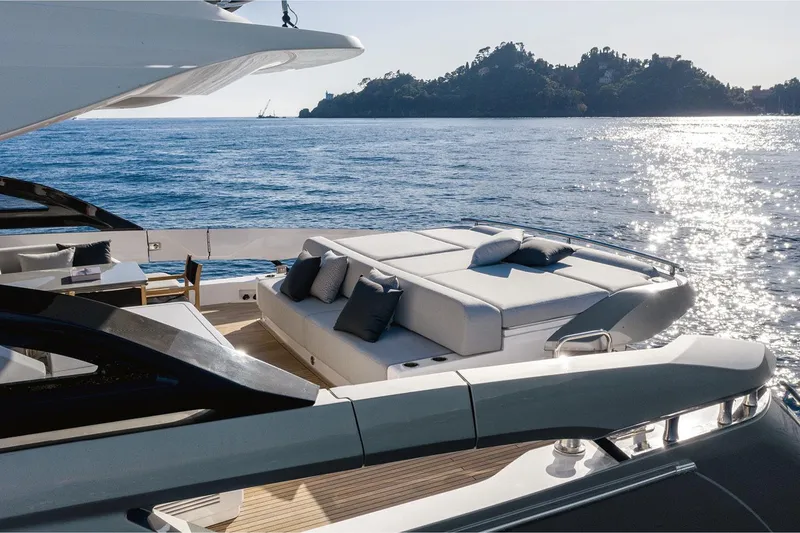 Slide: The Image of Luxurious 2022 Azimut S8 yacht with sun deck, ocean view, and scenic island backdrop. - 11