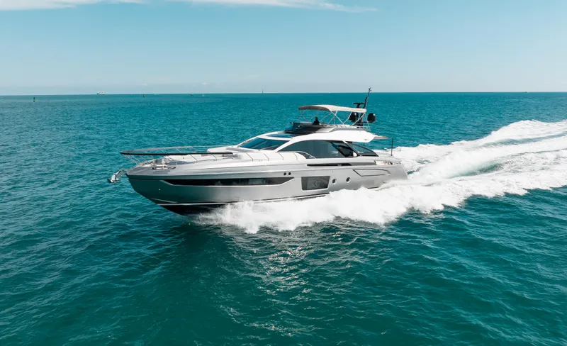Slide: The Image of 2022 Azimut S8 yacht cruising on open sea under clear blue sky. - 2