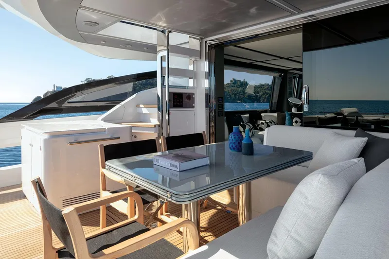 Slide: The Image of Luxurious 2022 Azimut S8 yacht deck with elegant dining area and ocean view. - 22