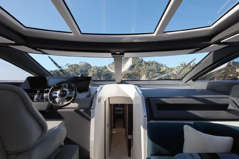 Slide: The Image of Interior view of 2022 Azimut S8 yacht cockpit with panoramic windows and modern design. - 30
