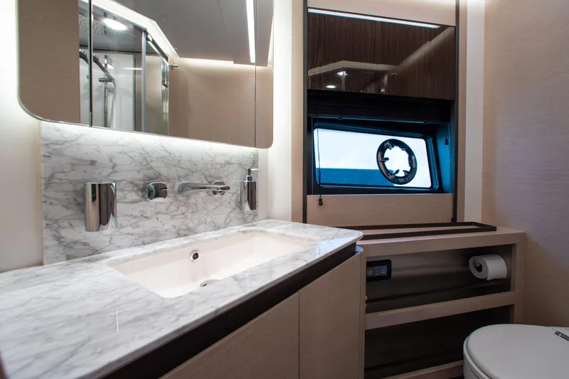 Slide: The Image of Luxurious bathroom in 2022 Azimut S8 yacht with marble countertop and modern fixtures. - 41