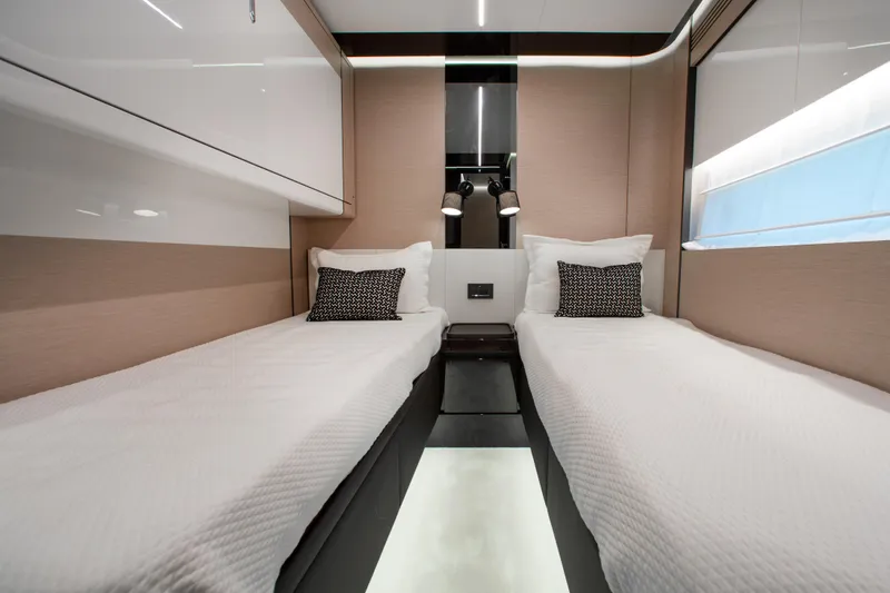 Slide: The Image of Luxurious twin cabin interior of 2022 Azimut S8 yacht with modern design and elegant bedding. - 44