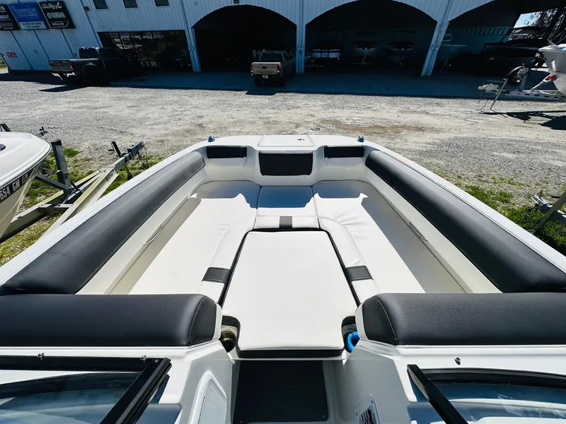 Slide: The Image of 2023 Bayliner DX 2050 boat interior with spacious seating and modern design. - 14