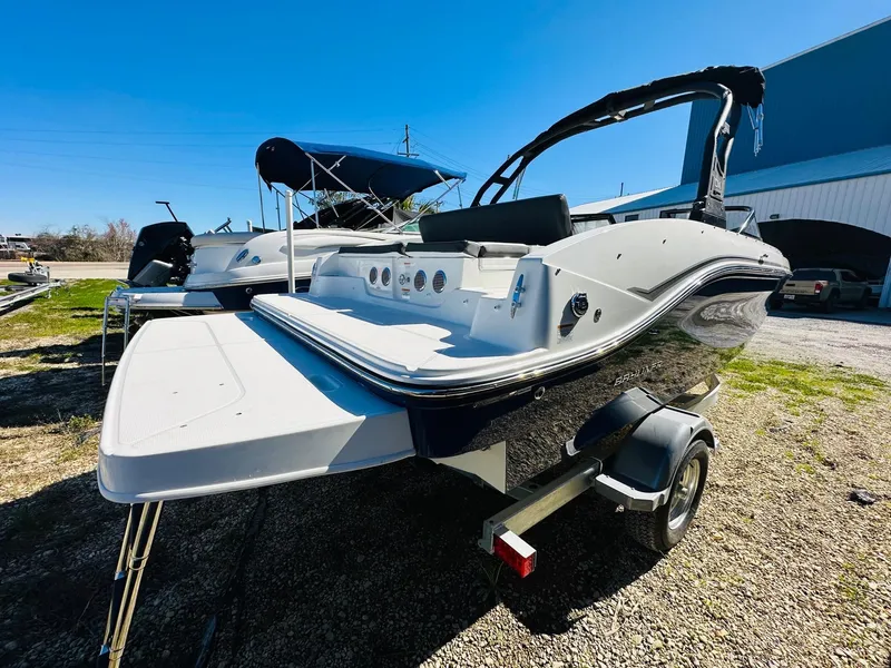 Slide: The Image of 2023 Bayliner DX 2050 boat on trailer, rear view. - 2