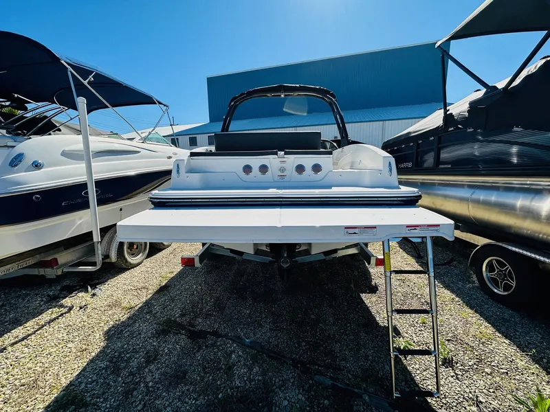 Slide: The Image of 2023 Bayliner DX 2050 boat rear view with extended swim platform. - 5