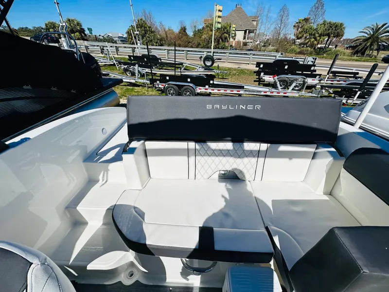Slide: The Image of 2023 Bayliner DX 2050 boat interior with seating and backrest. - 8