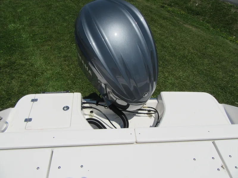 Slide: The Image of 2023 Robalo R230 Center Console boat engine and deck. - 18