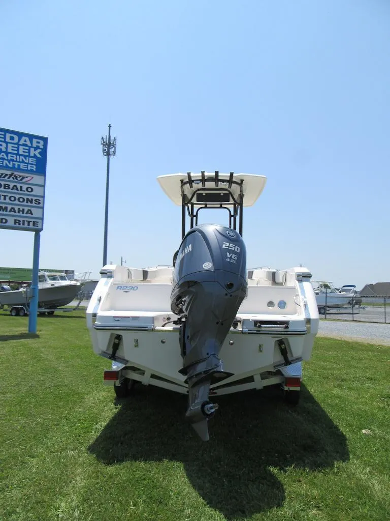 Slide: The Image of 2023 Robalo R230 Center Console boat with Yamaha 250 V6 engine, rear view. - 5