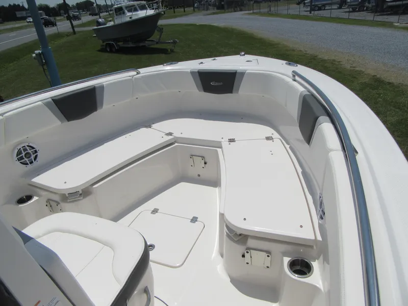 Slide: The Image of 2023 Robalo R230 Center Console boat interior with seating and storage compartments. - 6