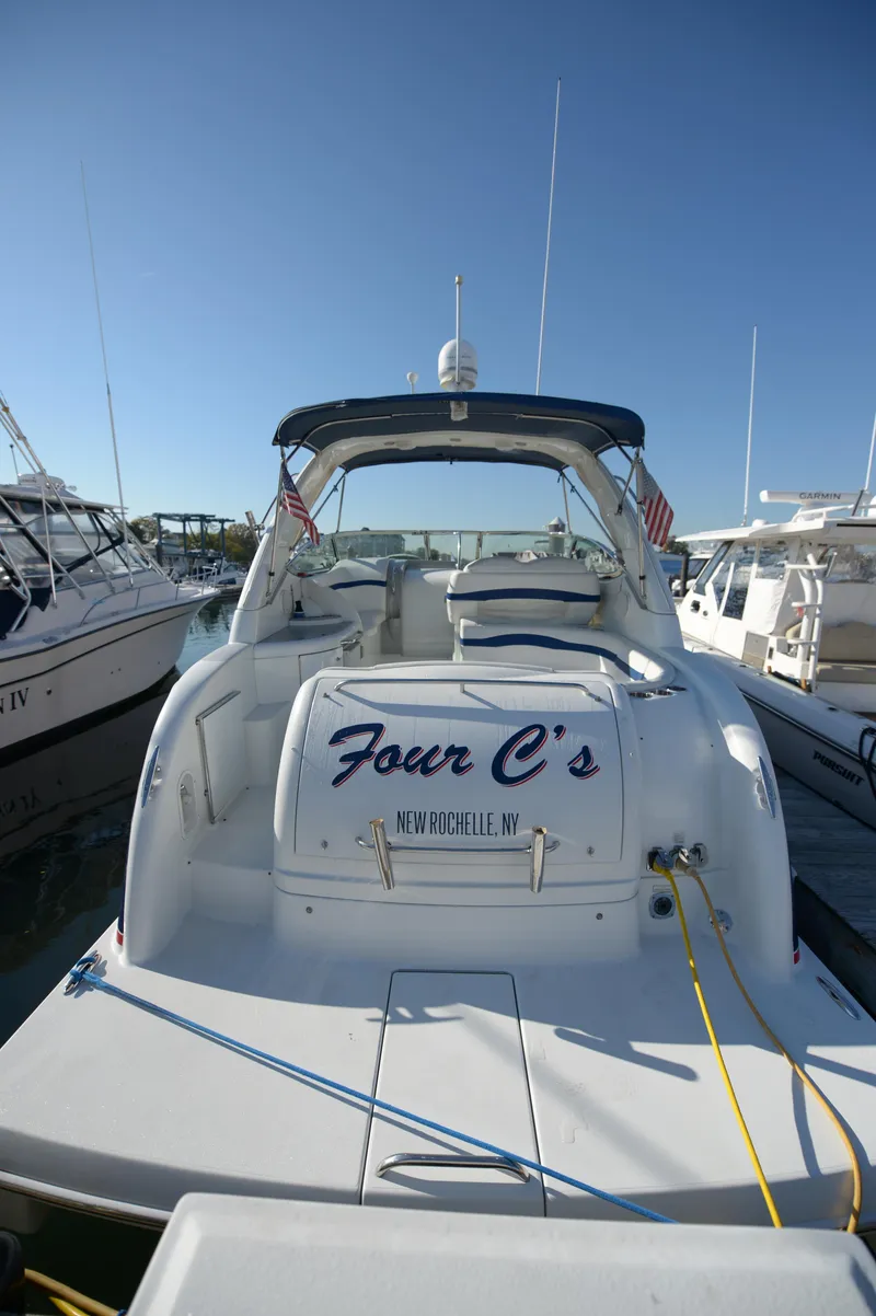 Slide: The Image of 2007 Formula 34 PC yacht docked, rear view, with "Four C's" name visible. - 17