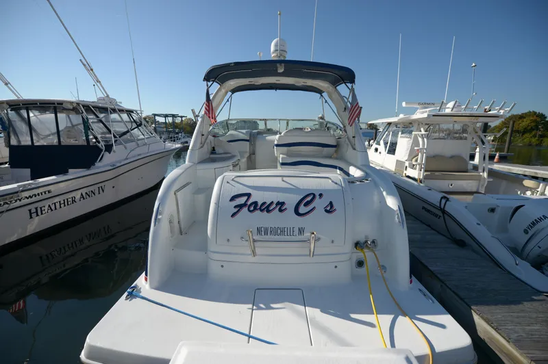 Slide: The Image of 2007 Formula 34 PC yacht docked, rear view, with "Four C's" name visible. - 18