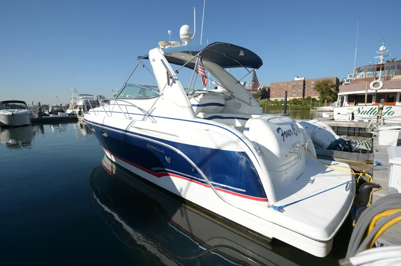 Slide: The Image of 2007 Formula 34 PC yacht docked at marina under clear blue sky. - 19