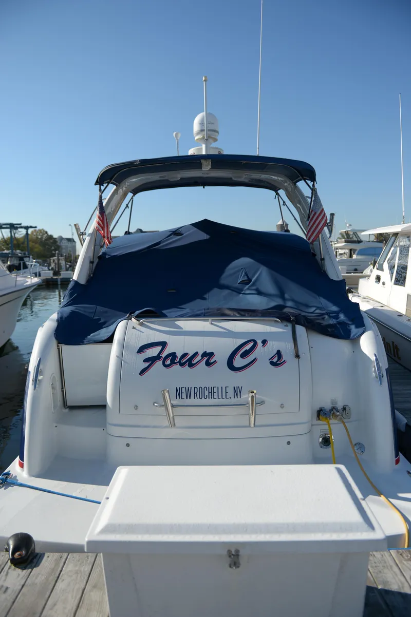 Slide: The Image of 2007 Formula 34 PC yacht docked, rear view with cover, named "Four C's," New Rochelle, NY. - 2