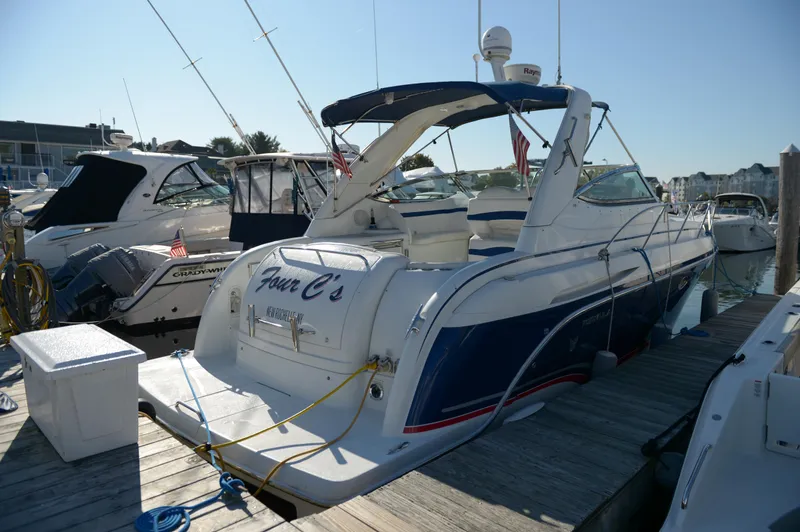 Slide: The Image of 2007 Formula 34 PC yacht docked at marina, featuring sleek design and blue accents. - 22