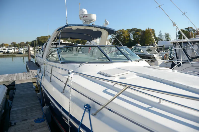 Slide: The Image of 2007 Formula 34 PC yacht docked at marina, clear sky, surrounded by other boats. - 23