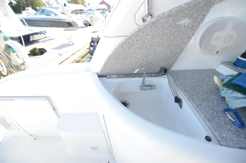 Slide: The Image of 2007 Formula 34 PC boat sink area with countertop and faucet. - 28