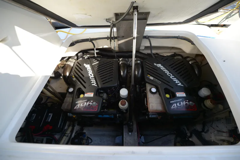 Slide: The Image of Twin Mercury engines in a 2007 Formula 34 PC boat engine compartment. - 42