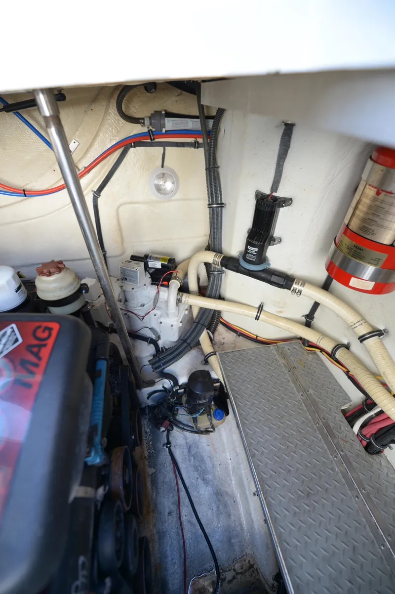 Slide: The Image of Engine compartment of a 2007 Formula 34 PC boat, showing wiring and mechanical components. - 48